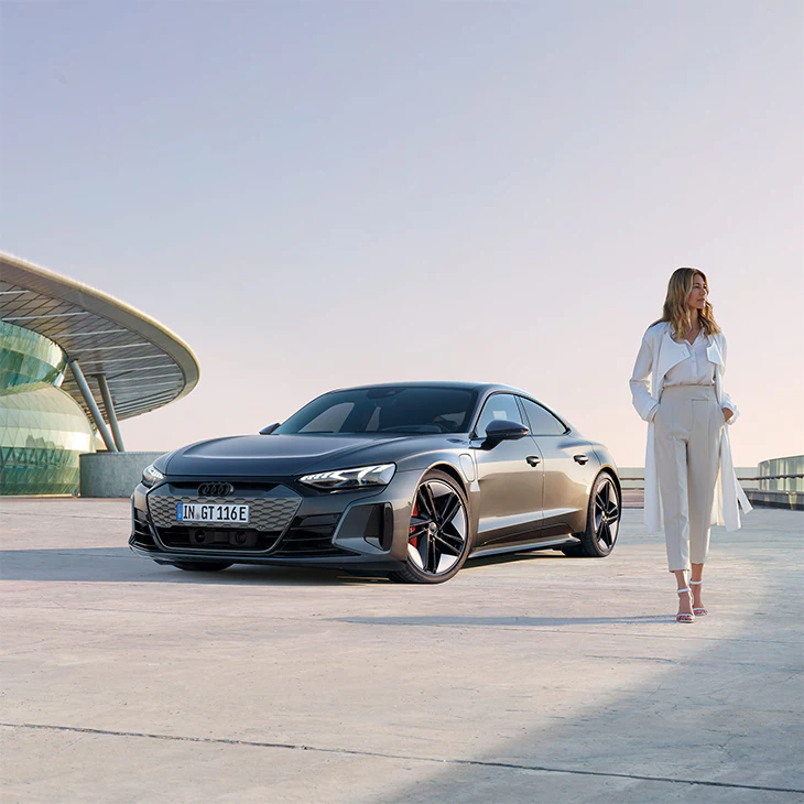 Woman in front of Audi RS e-tron GT 